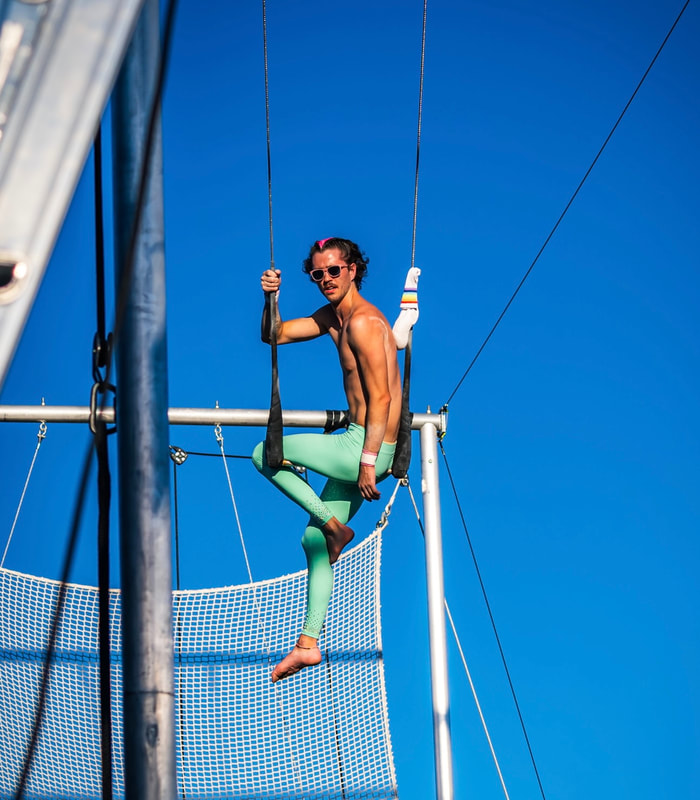Photo of Aidan in the catch trapeze