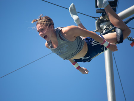 Photo of Darcy in the catch trapeze